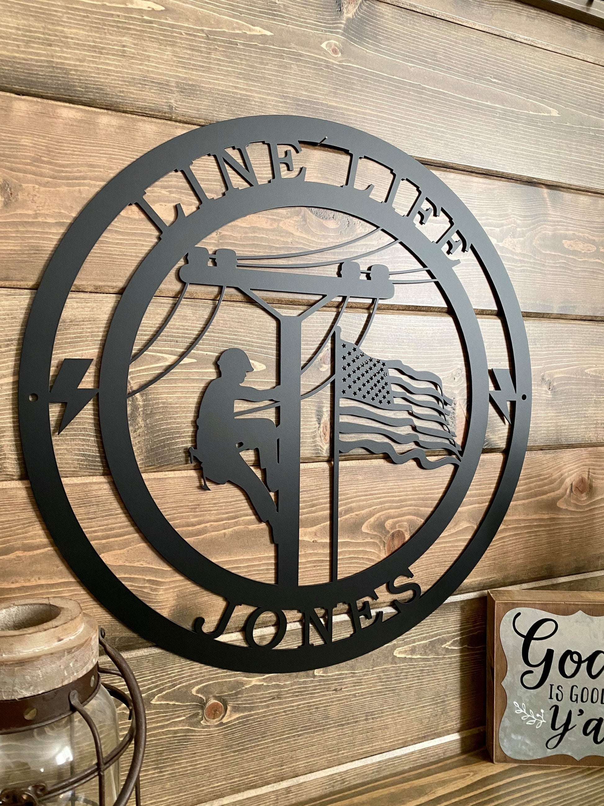 a metal sign on a wooden wall